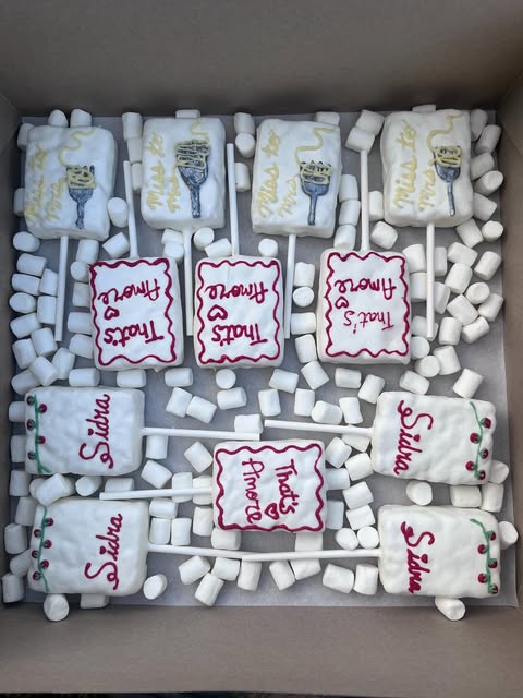 White rice krispie pops lettered That's Amore and Miss to Mrs for a bridal shower